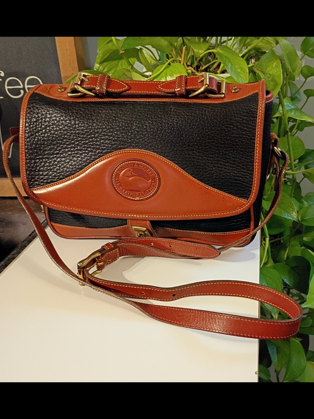 Dooney & Bourke Black with Brown Trim Pebbled Leather Crossbody